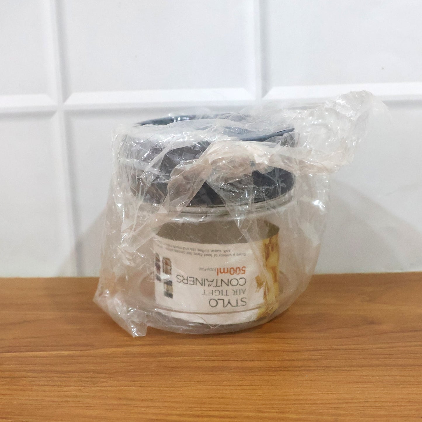 Clear kitchen container with tight-fitting lid