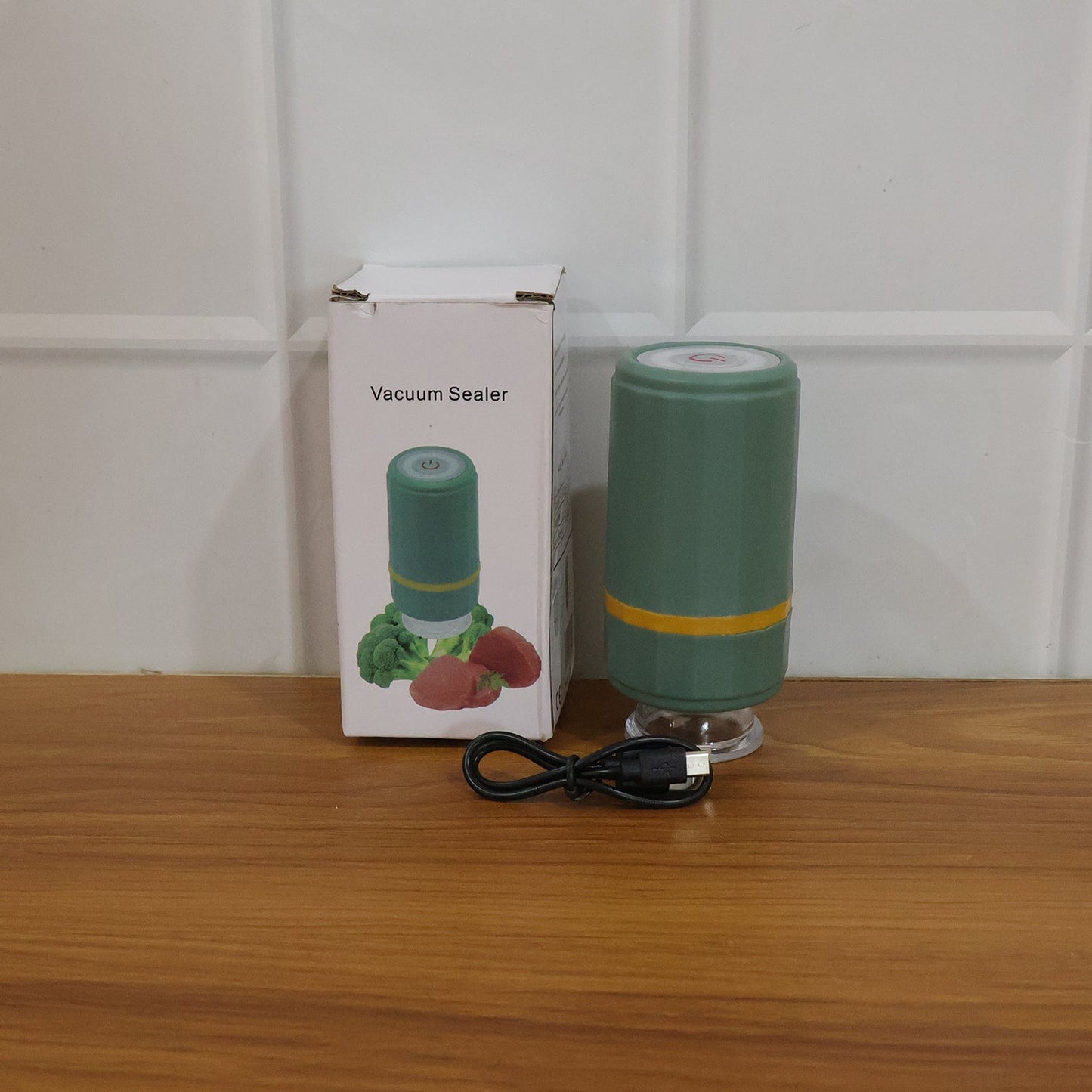 compact vacuum sealing device