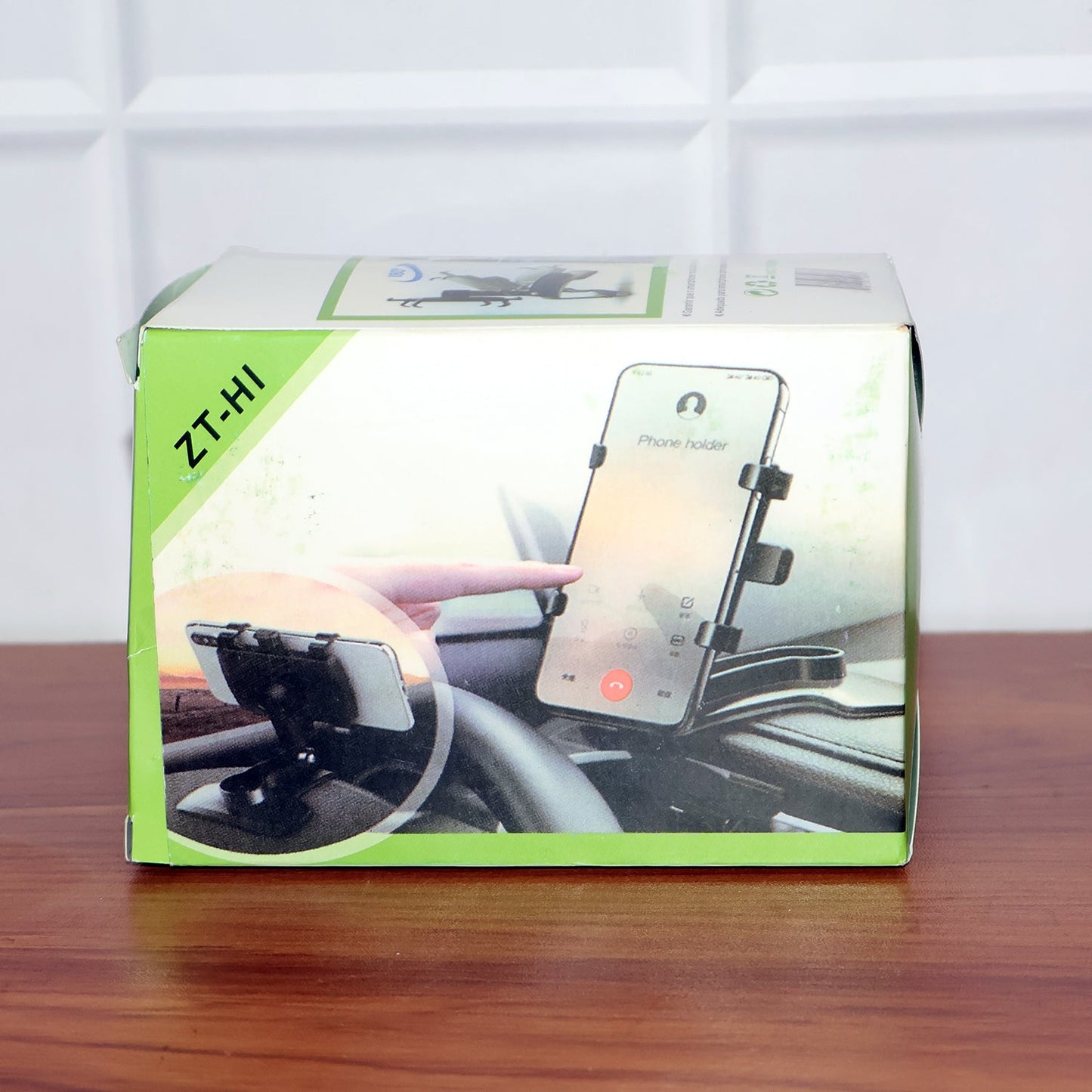 Compact rotating phone holder for vehicles