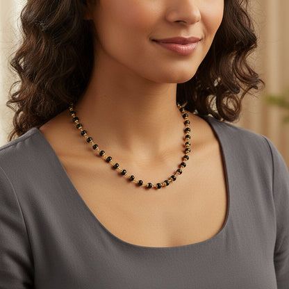 Long gold bead necklace        
